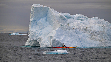 Kayakers between the floating icebergs, Ilulissat Icefjord, UNESCO World Heritage Site, Western Greenland, Denmark, Polar Regions