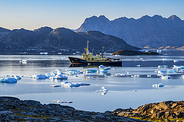 Fishing trawler in the mountainous fjord, Kulusuk, Greenland, Denmark, Polar Regions