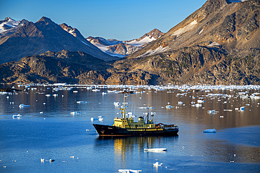 Fishing trawler in the mountainous fjord, Kulusuk, Greenland, Denmark, Polar Regions