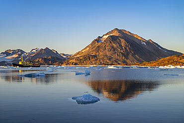 Fishing trawler in the mountainous fjord, Kulusuk, Greenland, Denmark, Polar Regions