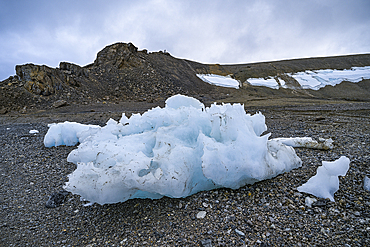 Chunks of ice on a rocky beach, Baffin island, Nunavut, Canadian Arctic, Canada, North America