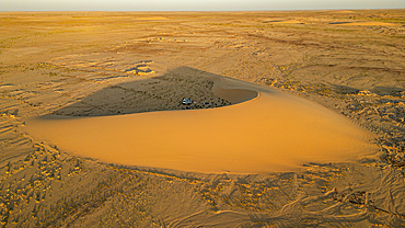 Aerial of sunset over a beautiful sand dune in the Tibesti Mountains, Chad, Africa