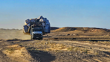 Full packed truck in the Sahel zone on his way to the Tibesti Mountains, Chad, Africa