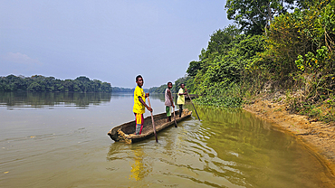 Boys in canoe, Sangha River, Unesco site Dzanga Sangha National Park, Central African Republic