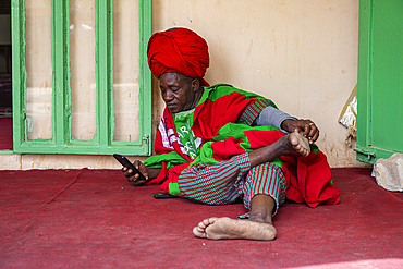 Bored bodyguard in the Fadar Daurama Emir palace, Daura Emirate, Katsina state, Nigeria