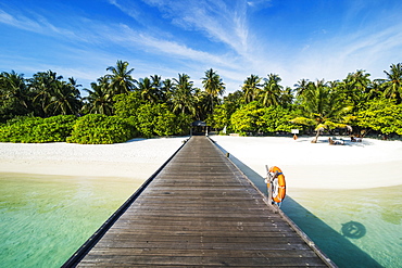 Long pier leading to a small island over turquoise water, Sun Island Resort, Nalaguraidhoo island, Ari atoll, Maldives, Indian Ocean, Asia