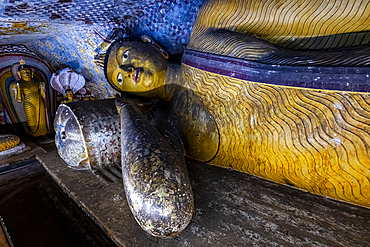 Exploring Buddha statues at Dambulla cave temple in Central Sri Lanka with intricate designs and a rich history