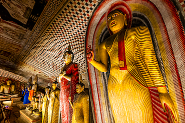 Buddha statues in Dambulla cave temple showcasing religious art and culture in Sri Lanka
