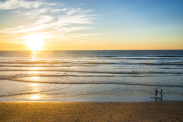 Couple in backlight walking at sunset, Del Mar, California, United States of America, North America