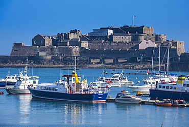 Fishing boats below Cornet castle, Saint Peter Port, Guernsey, Channel Islands, United Kingdom, Europe 