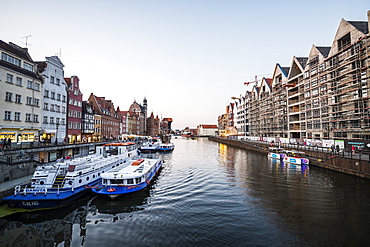 Hanseatic League houses on the Motlawa River at sunset in the pedestrian zone of Gdansk, Poland, Europe