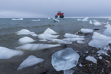 Icebreaker anchoring behind an iceberg, Champ Island, Franz Josef Land archipelago, Arkhangelsk Oblast, Arctic, Russia, Europe