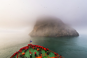 Icebreaker approaching the Skala Rubini (Rubini rock), Franz Josef Land archipelago, Arkhangelsk Oblast, Arctic, Russia, Europe