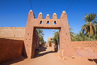 Red town gate in Timimoun, western Algeria, North Africa, Africa