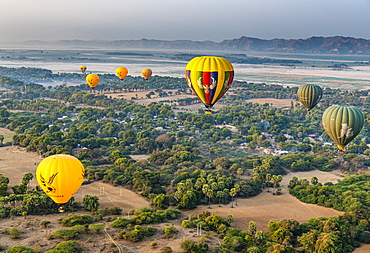 Hot air balloons at sunrise over temples of Bagan (Pagan), Myanmar (Burma), Asia