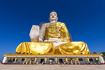 Giant sitting Buddha below the Kyaiktiyo Pagoda (Golden Rock), Mon state, Myanmar (Burma), Asia