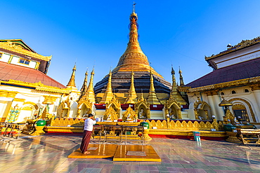 Man praying in the Kyaikthanian paya, Mawlamyine, Mon state, Myanmar (Burma), Asia