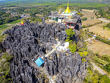 Aerial by drone of Kyauktalon Taung crag with a Hindu temple, near Mawlamyine, Mon state, Myanmar (Burma), Asia