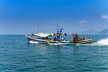 Sea gypsies Moken on their fishing boat, Mergui (Myeik) Archipelago, Myanmar (Burma), Asia