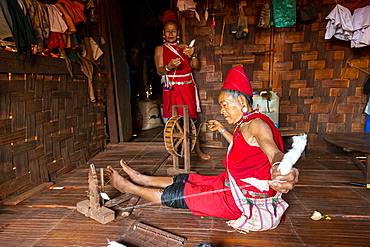 Old Kayan women weaving the traditional way, Kayah village, Loikaw area, Kayah state, Myanmar (Burma), Asia