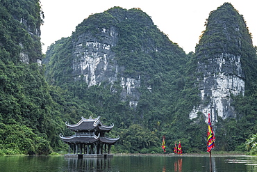 Temple standing between the scenic limestone mountains of Trang An Landscape Complex, UNESCO World Heritage Site, Vietnam, Indochina, Southeast Asia, Asia