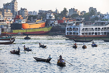 Passenger Canoes in the port of Dhaka in front of a passenger ferry, Dhaka, Bangladesh, Asia