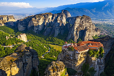 Aerial by drone of the Holy Monastery of Varlaam at sunrise, UNESCO World Heritage Site, Meteora Monasteries, Greece, Europe