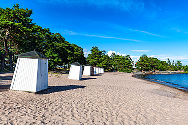 Beach huts on a deserted beach, Hanko, southern Finland, Europe