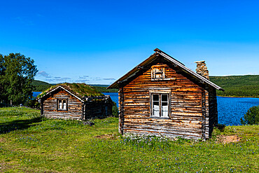 Historic houses on the Karasjohka River bordering Norway and Finland, Lapland, Finland, Europe