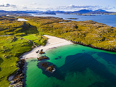 Aerial of white sand and turquoise water at Bosta Beach, Isle of Lewis, Outer Hebrides, Scotland, United Kingdom, Europe