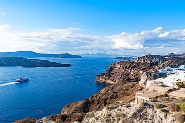 Ferry passing the calderea of Fira, Santorini, Cyclades, Greek Islands, Greece, Europe