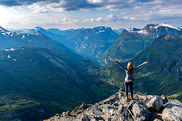 Woman standing on Dalsnibba View point, Geirangerfjord, UNESCO World Heritage Site, Sunnmore, Norway, Scandinavia, Europe