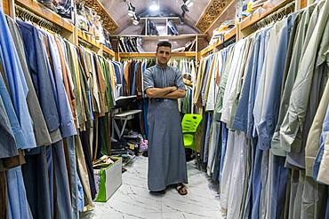 Man in his clothes shop, Ezekiel's Tomb, Al Kifl, Kerbala, Iraq, Middle East