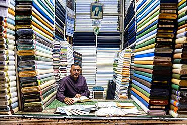 Man in his cloth shop in the Imam Ali Holy Shrine, Najaf, Iraq, Middle East