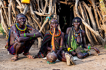 Old woman of the Jiye tribe smoking a pipe, Eastern Equatoria State, South Sudan, Africa