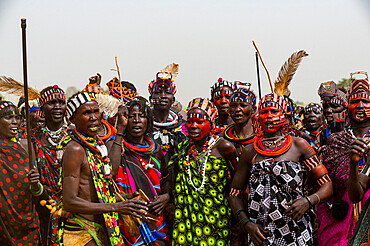 Traditional dressed women of the Jiye tribe dancing and singing, Eastern Equatoria State, South Sudan, Africa