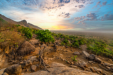 Sunset over traditional huts of the Otuho (Lotuko) tribe, Imatong mountains, Eastern Equatoria, South Sudan, Africa