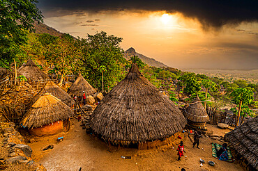 Sunset over traditional huts of the Otuho (Lotuko) tribe, Imatong mountains, Eastern Equatoria, South Sudan, Africa