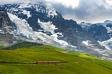 The Jungfrau railway below the Eiger North Face, Kleine Scheidegg, Bernese Oberland, Switzerland, Europe