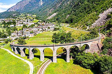 Aerial of the Brusio spiral viaduct, UNESCO World Heritage Site, Rhaetian Railway, Switzerland, Europe