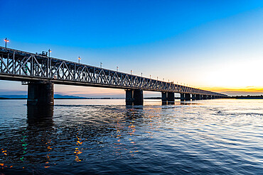 Giant bridge spanning over the Amur River at sunset, Khabarovsk, Khabarovsk Krai, Russia, Eurasia