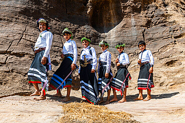 Young man and boys of the Qahtani flower tribe, Asir Mountains, Kingdom of Saudi Arabia, Middle East