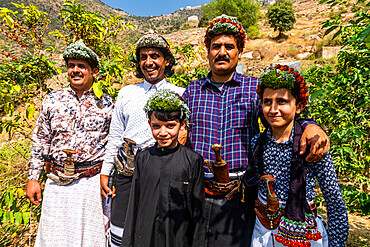 Traditional dressed men of the Qahtani Flower men tribe, with his sons, Asir Mountains, Kingdom of Saudi Arabia, Middle East