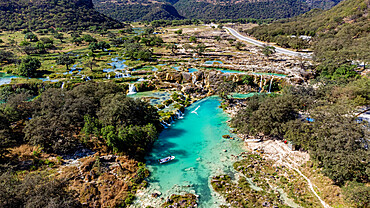 Aerial of turquoise waterfalls, Wadi Darbat, Salalah, Oman, Middle East