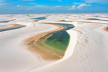 Aerial of freshwater lakes between huge sand dunes in the Lencois Maranhenses National Park, Maranhao, Brazil, South America