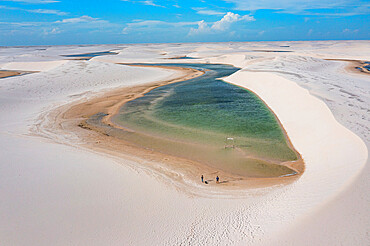 Aerial of freshwater lakes between huge sand dunes in the Lencois Maranhenses National Park, Maranhao, Brazil, South America