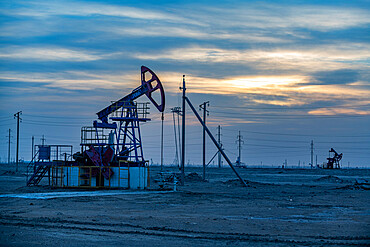 Oil rigs at sunset, Novy Uzen, Mangystau, Kazakhstan, Central Asia, Asia