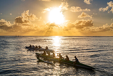 Rowing competition at sunset, Rurutu, Austral islands, French Polynesia, South Pacific, Pacific