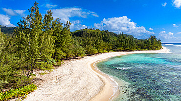 Aerial over the white sand beach, west coast Rurutu, Austral islands, French Polynesia, South Pacific, Pacific