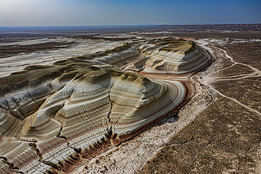 Aerial of multicoloured layers of sandstone, Kyzylkup, Mangystau, Kazakhstan